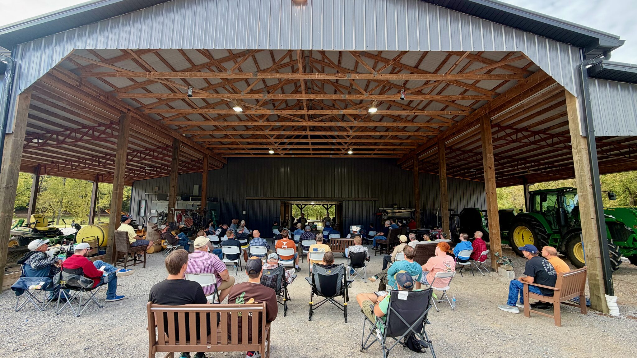 Men gathered under the pavilion for fellowship on September 26, 2026