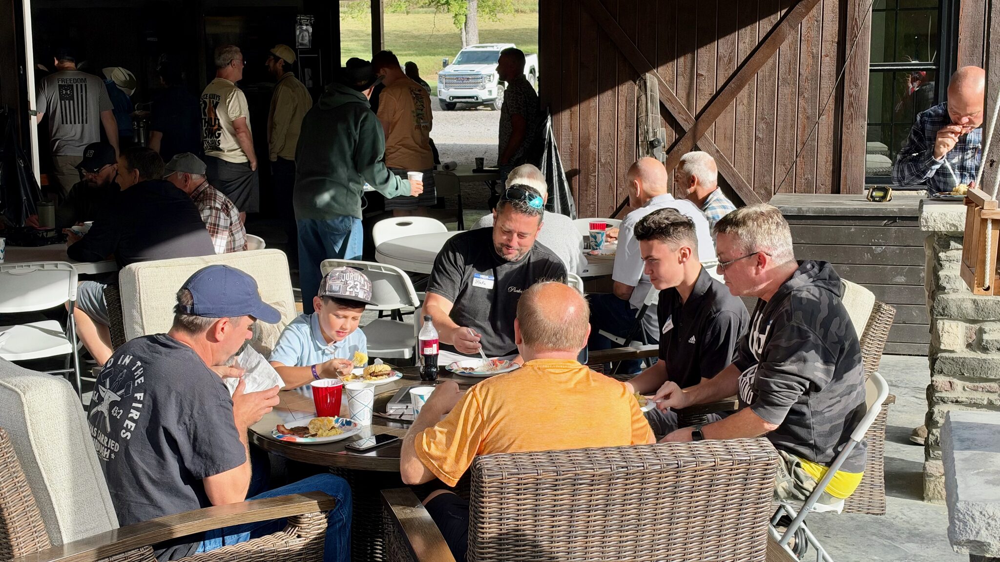 Men and boys sharing a meal at the Faith Relentless September 26, 2026 gathering
